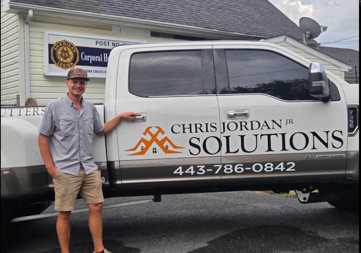 Chris Jordan Jr beside the Chris Jordan Jr Solutions truck